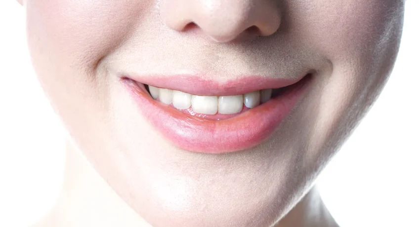 young-woman-with-toothy-smile-close-up-2023-11-27-05-19-30-utc